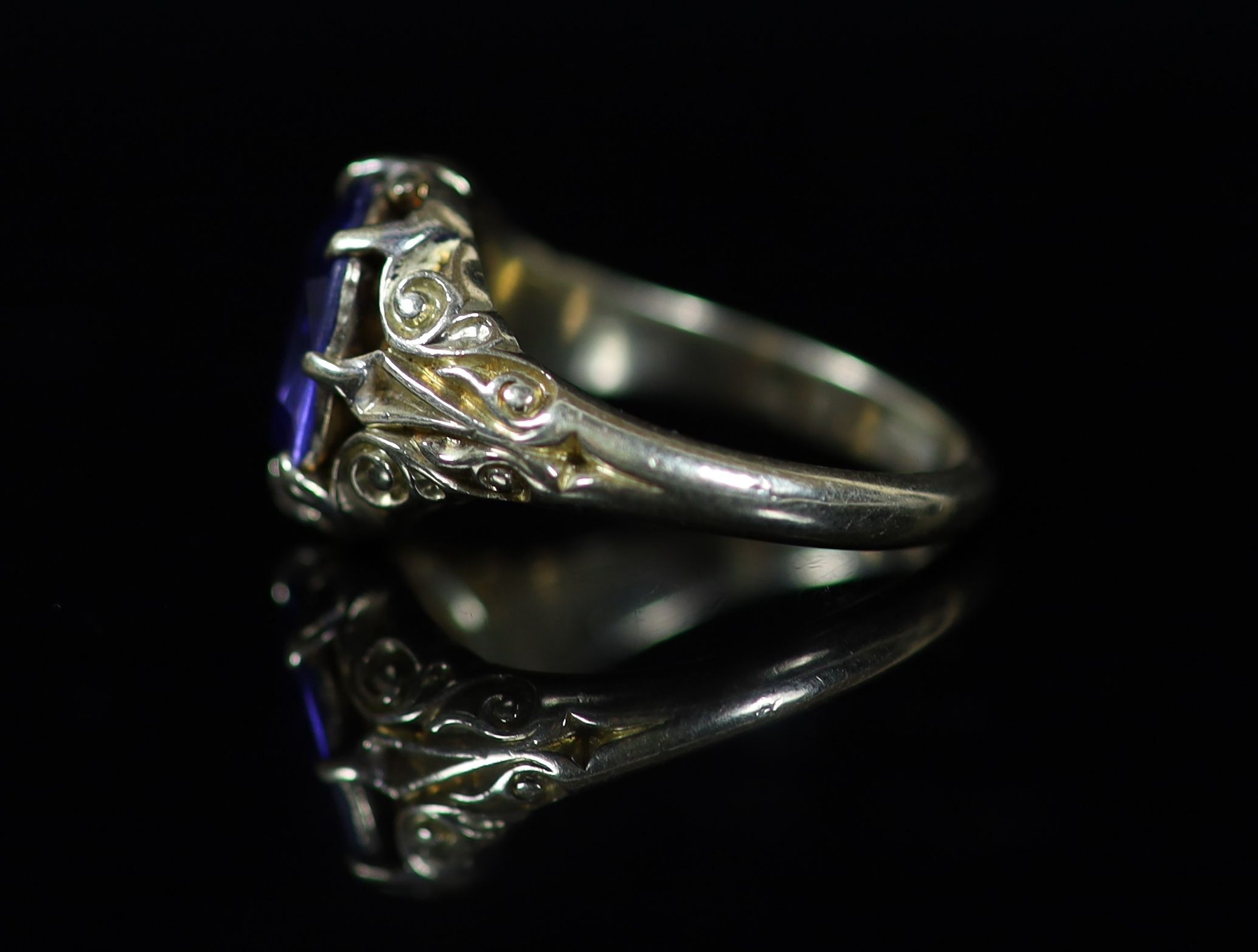 An 18ct gold and single stone claw set sapphire ring